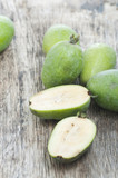 fresh feijoa fruits on a wooden background
