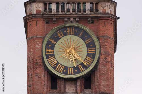 Medieval clock tower on a building in Europe 