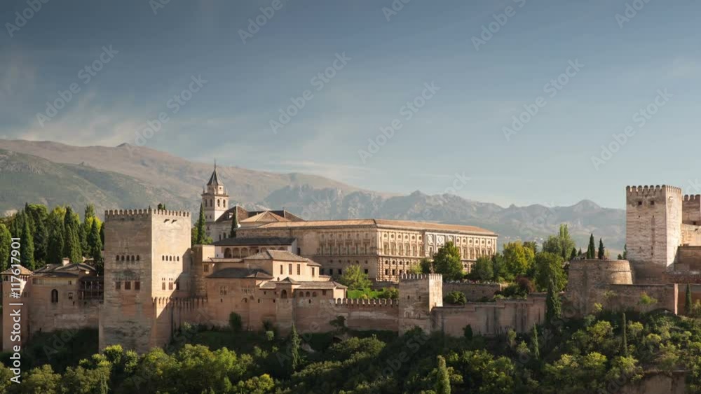 Time lapse of the alhambra palace in granada with the sierra nevada mountains in the distance Time lapse of the alhambra palace in granada with the sierra nevada mountains in the distance