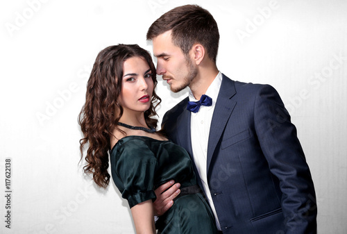Elegant couple on light background