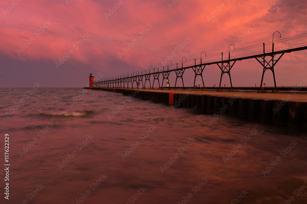 Colorful sunrise sky with lighthouse