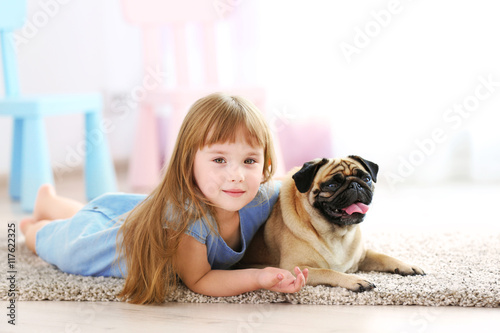 Cute girl playing with dog ...