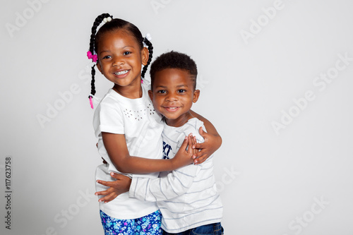 Young African American Siblings Hugging