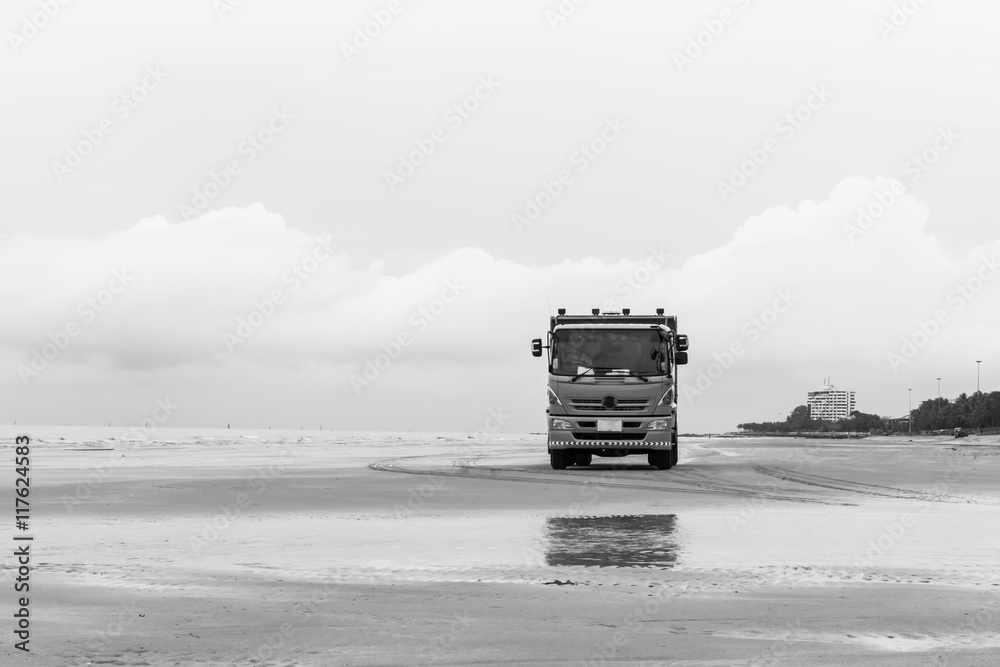 Fototapeta premium Truck on the beach with black and white