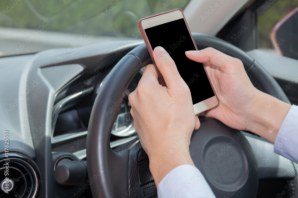 Businessman texting, chatting, playing on phone while careless driving
