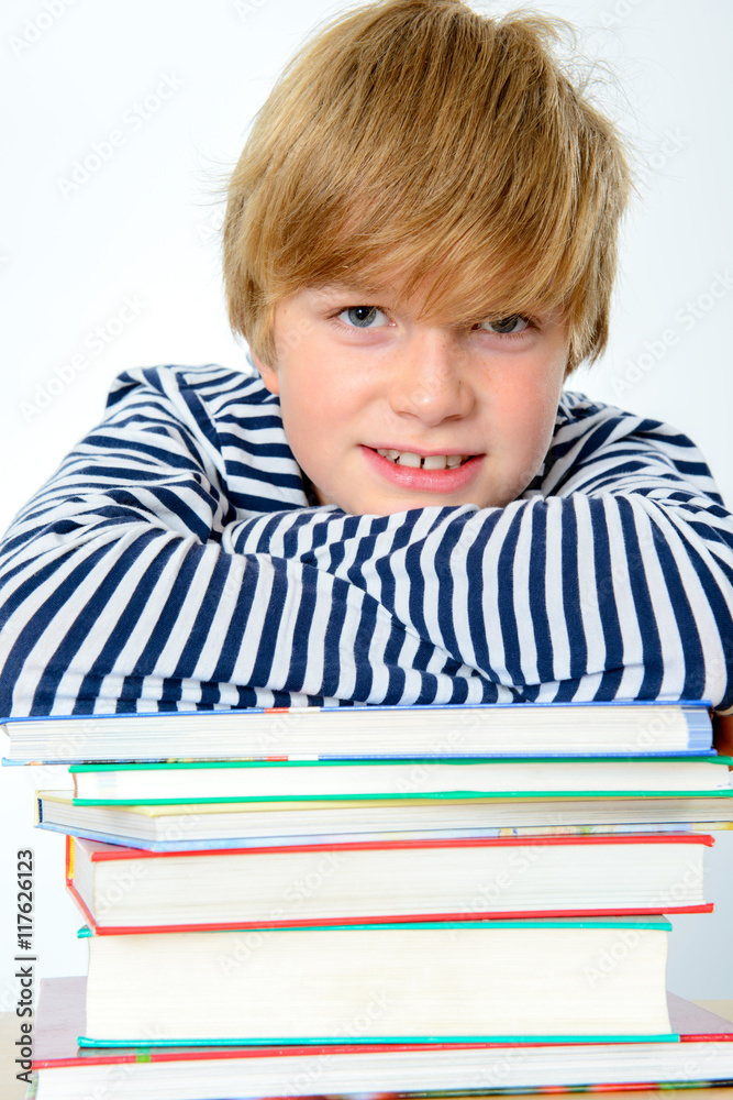 boy on a pile of books