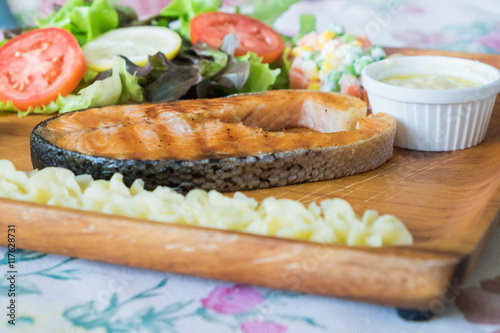 Grilled Salmon steak with salad.