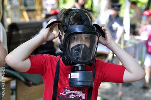 A boy in a gas mask