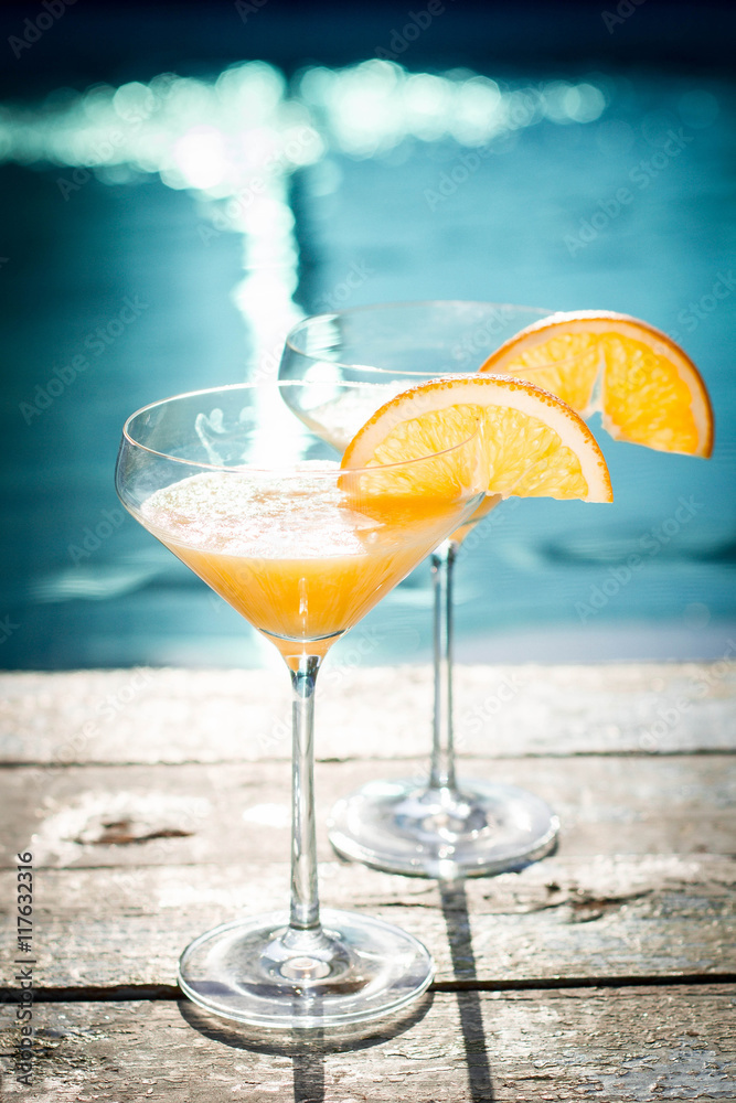cocktail on the pool nosing at the tropical resort