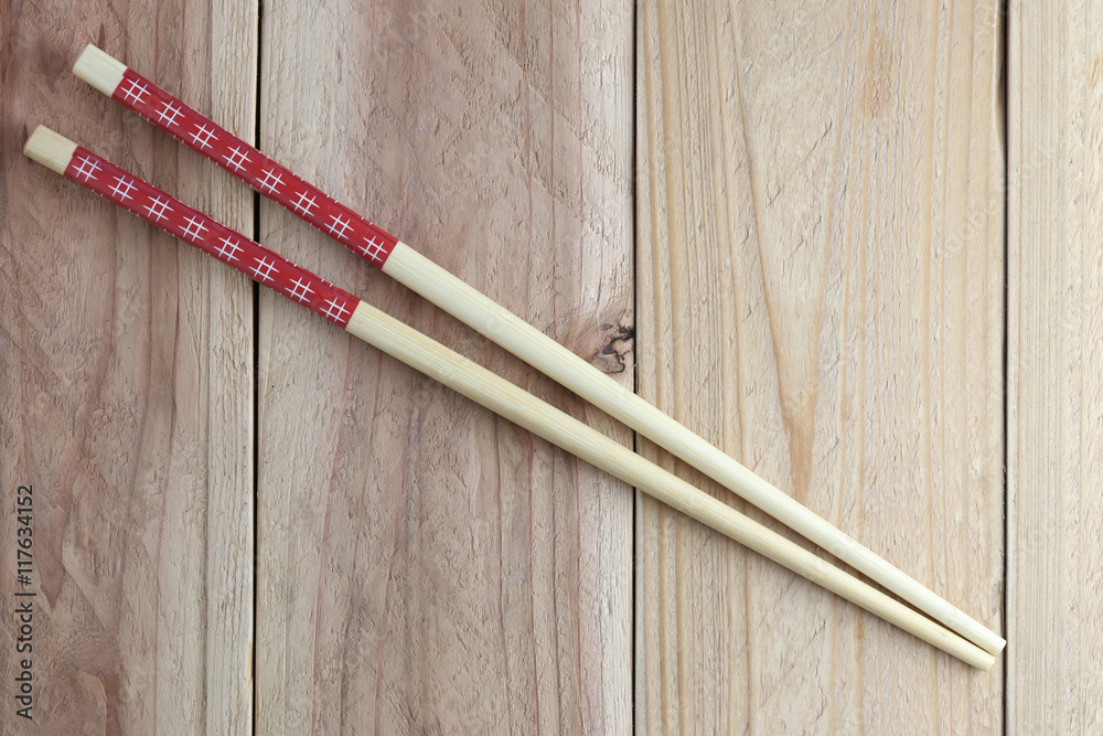 chopsticks spoon on wood floor. chopsticks spoon on wood floor.