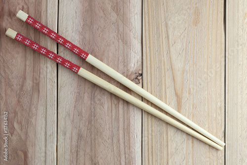 chopsticks spoon on wood floor.