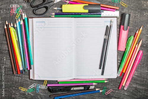 School supplies on blackboard 