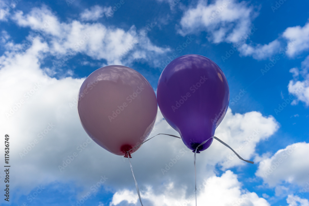 Fototapeta premium Wedding balloons flying up into the sky