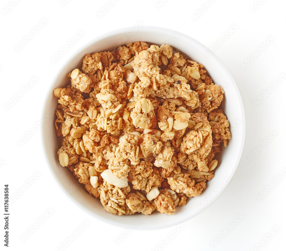 Bowl of whole grain muesli isolated on white, from above Bowl of whole grain muesli isolated on white, from above