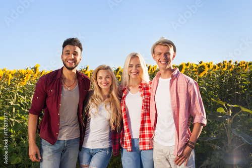 People group friends outdoor countryside sunflowers field
