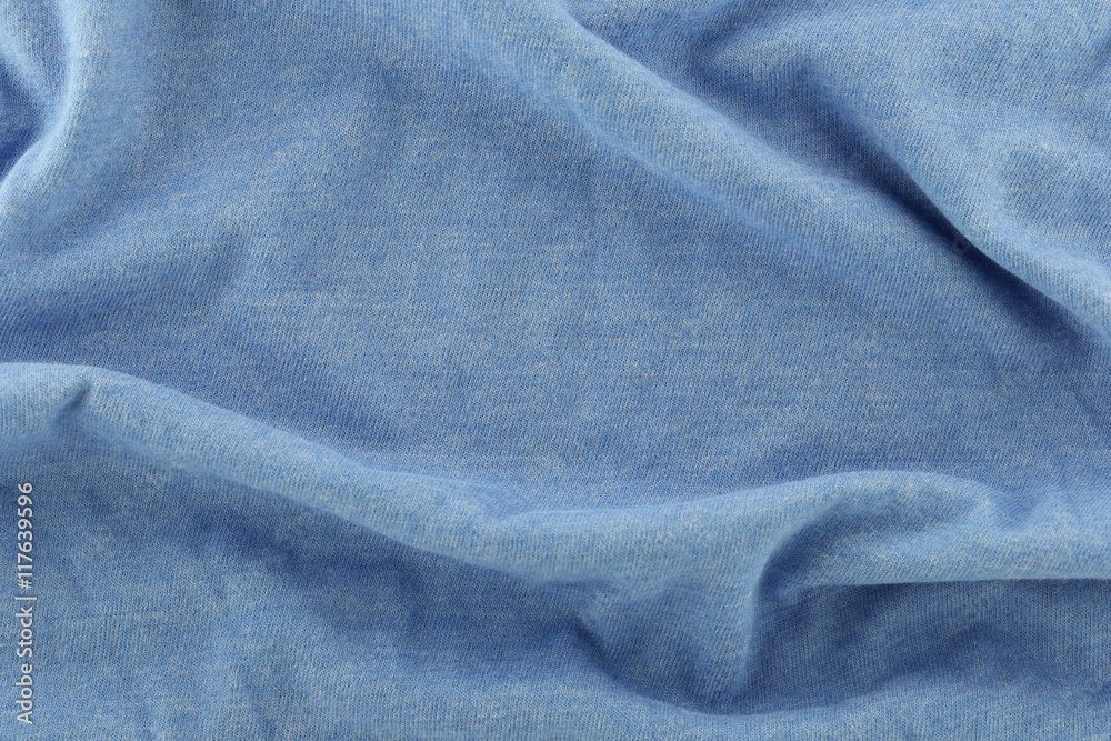 Fototapeta premium Closeup of rippled blue cotton fabric.