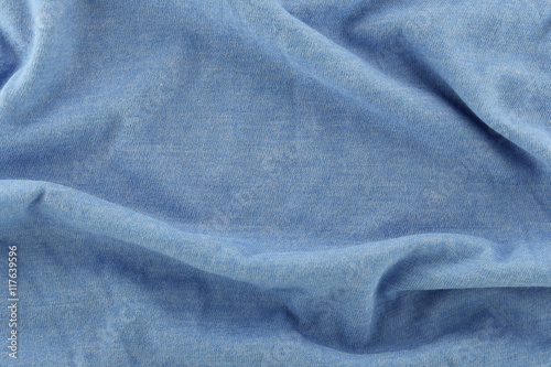 Closeup of rippled blue cotton fabric.