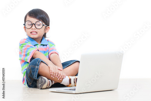 a cute boy using laptop 