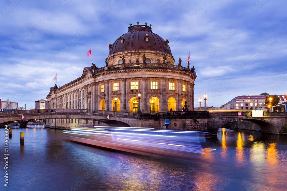 Berlin at night, boat on the River Spree in front of Museum Island