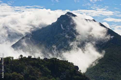 Mountain peaks of Suva Planina at morning covered with clouds in east Serbia