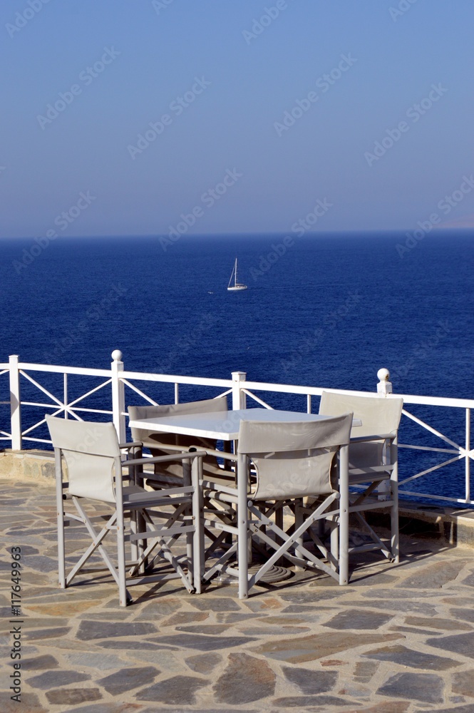 Terrace of white color on the background of ocean.