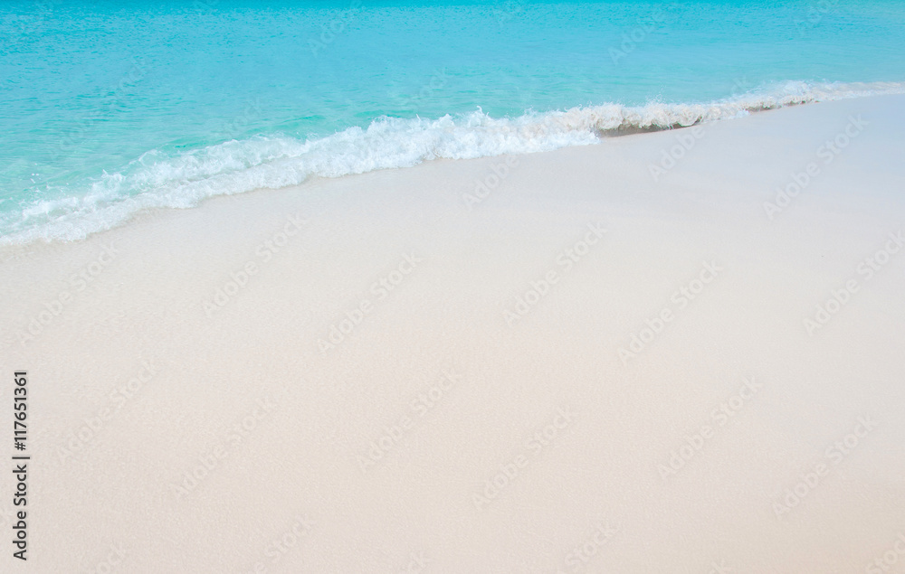 Tropical beach with coral white sand and calm wave