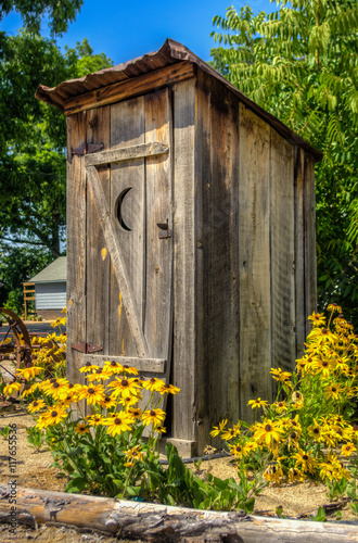Rustic Outhouse with flowers.