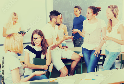 students chatting while sitting in the room