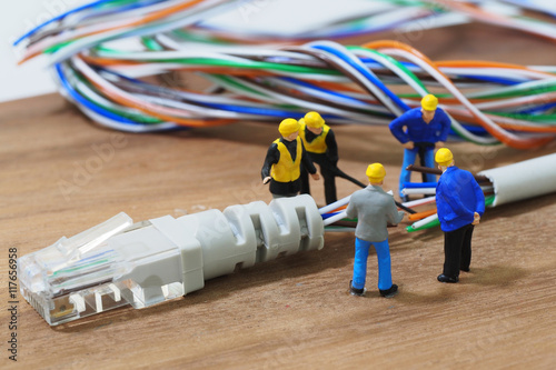 Group of engineer workers are repair LAN network connection Ethe