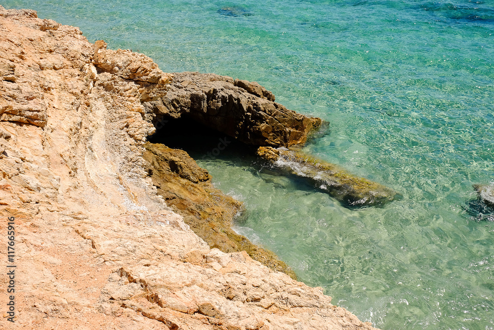 Crystal sea water and rock in Sardinia.