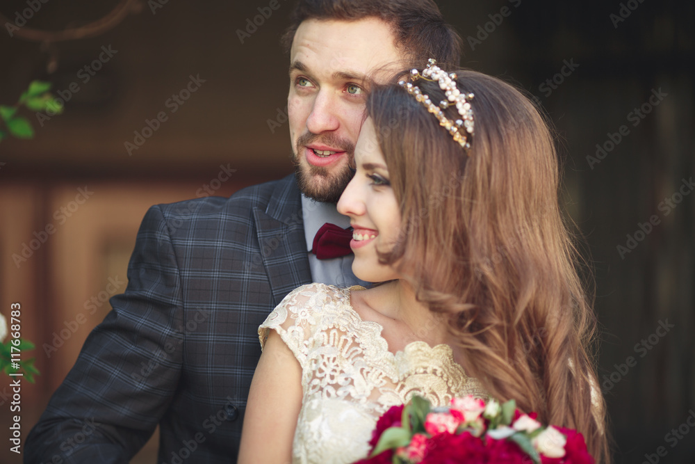 Kissing wedding couple in spring nature close-up portrait Kissing wedding couple in spring nature close-up portrait