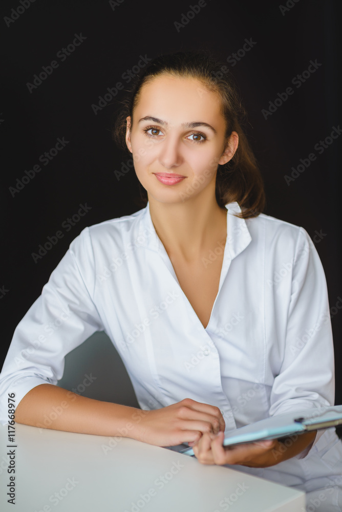 closeup portrait of young female medical worker in office closeup portrait of young female medical worker in office