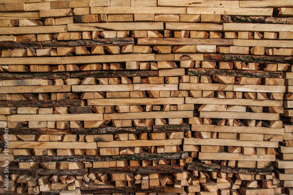 Fototapeta premium firewood in the stack, close-up. Wooden background.