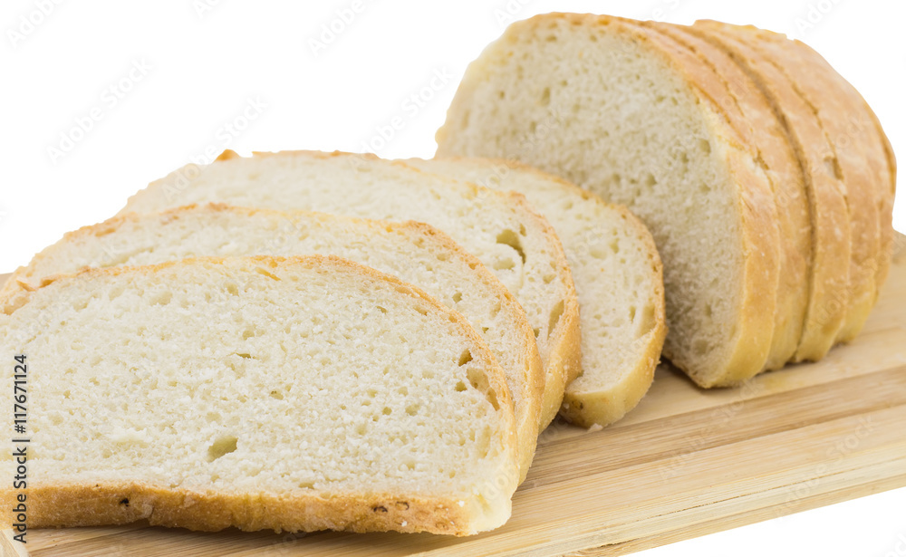 cutting wheat bread on a white background