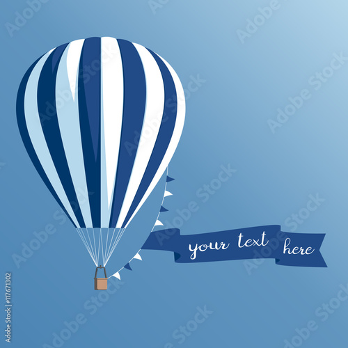 Hot air balloon with a banner on a blue background, striped hot air balloon with ribbon and flags flying in the sky