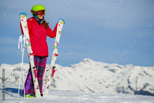 Ski, young skier girl enjoying winter vacation