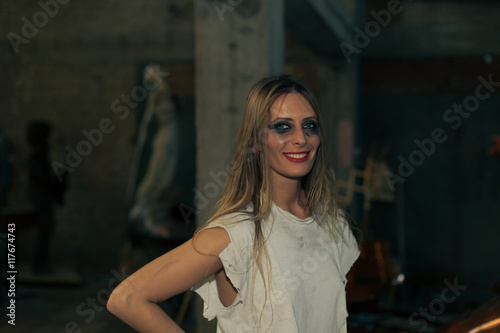young woman in torn t shirt and heavy smeared mascara © aerogondo