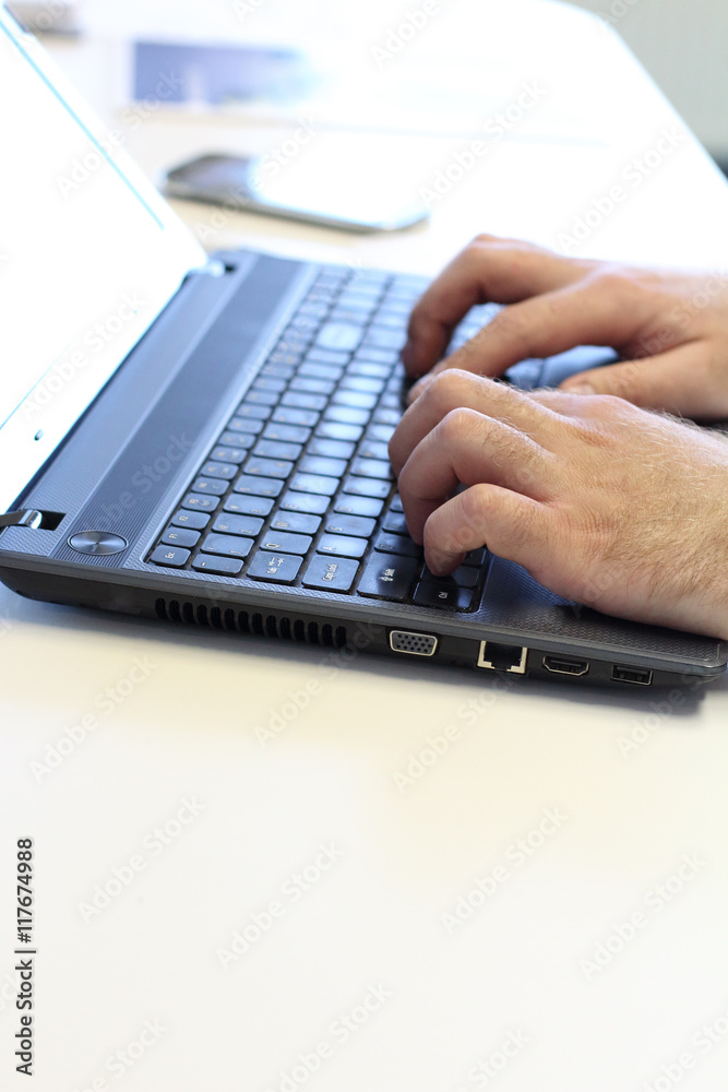 Human working in lap top Human working in lap top