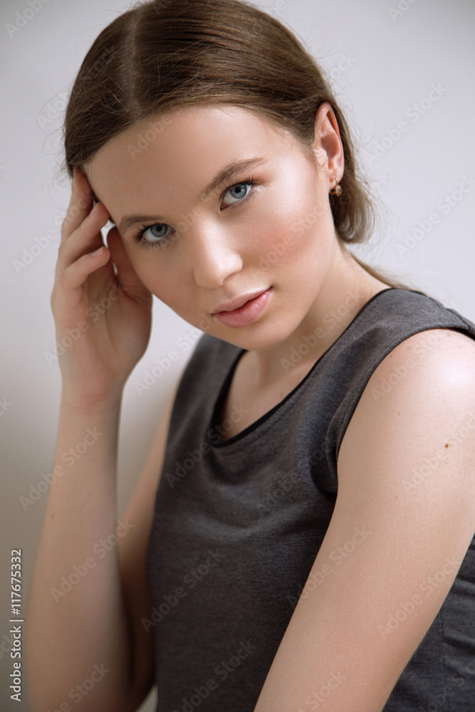 Brunet cheerful young woman. Beauty portrait, perfect makeup. Lo Brunet cheerful young woman. Beauty portrait, perfect makeup. Lo