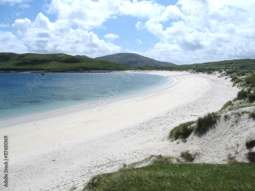 Pristine sandy beach and dunes on the island of Vatersay, Outer Hebrides, Scotland on a sunny summer's day;