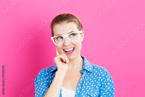 Young woman in a thoughtful pose