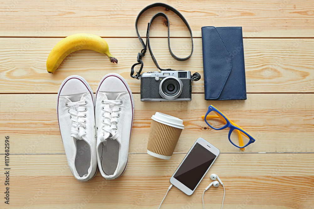 Top view of clothing and personal accessory on wooden background Top view of clothing and personal accessory on wooden background