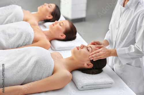 Beautiful girls relaxing in spa salon