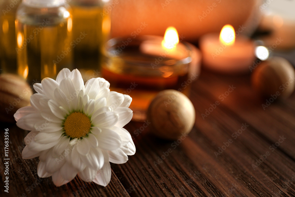 Fototapeta premium Beautiful spa set with flower on wooden table