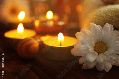 Beautiful spa set with flower on wooden table