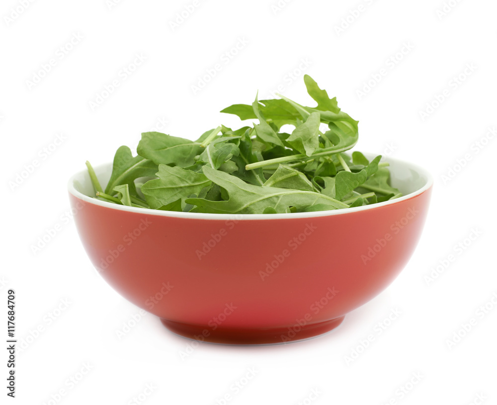 Bowl full of rocket salad leaves isolated Bowl full of rocket salad leaves isolated