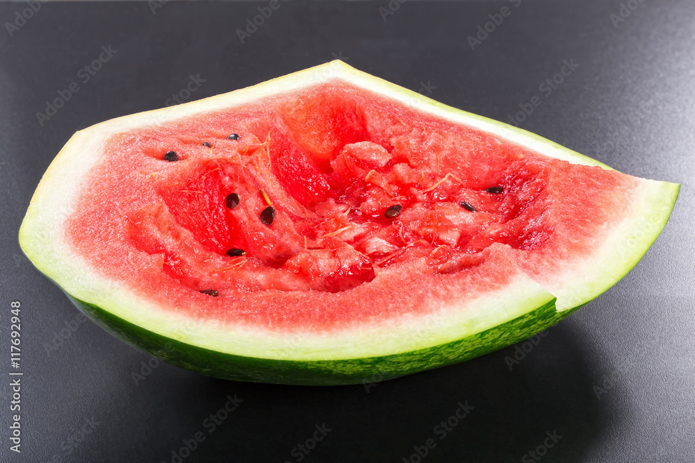 eaten watermelon on a black background eaten watermelon on a black background