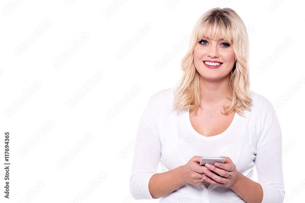 Smiling pretty woman using cellphone Smiling pretty woman using cellphone
