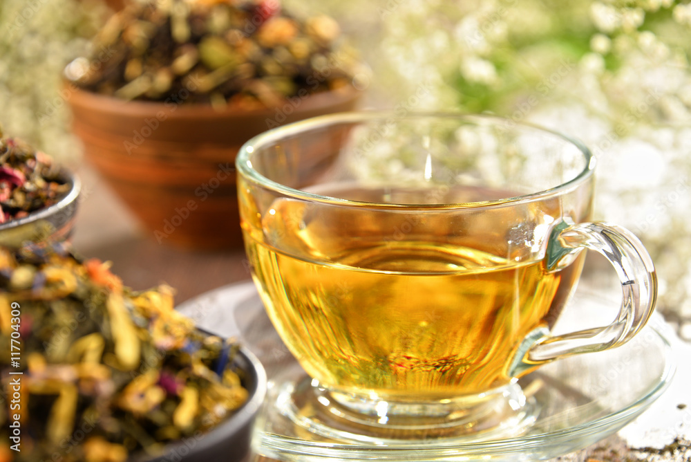 Composition with cup of tea and bowls of tea leaves Composition with cup of tea and bowls of tea leaves