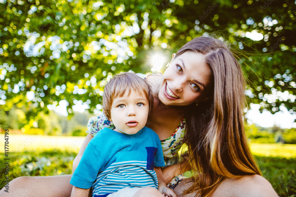 Mother and son happy in the park.Mother and Son Having Fun